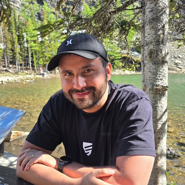 Jordan outdoors by a lake in the Canadian Rockies